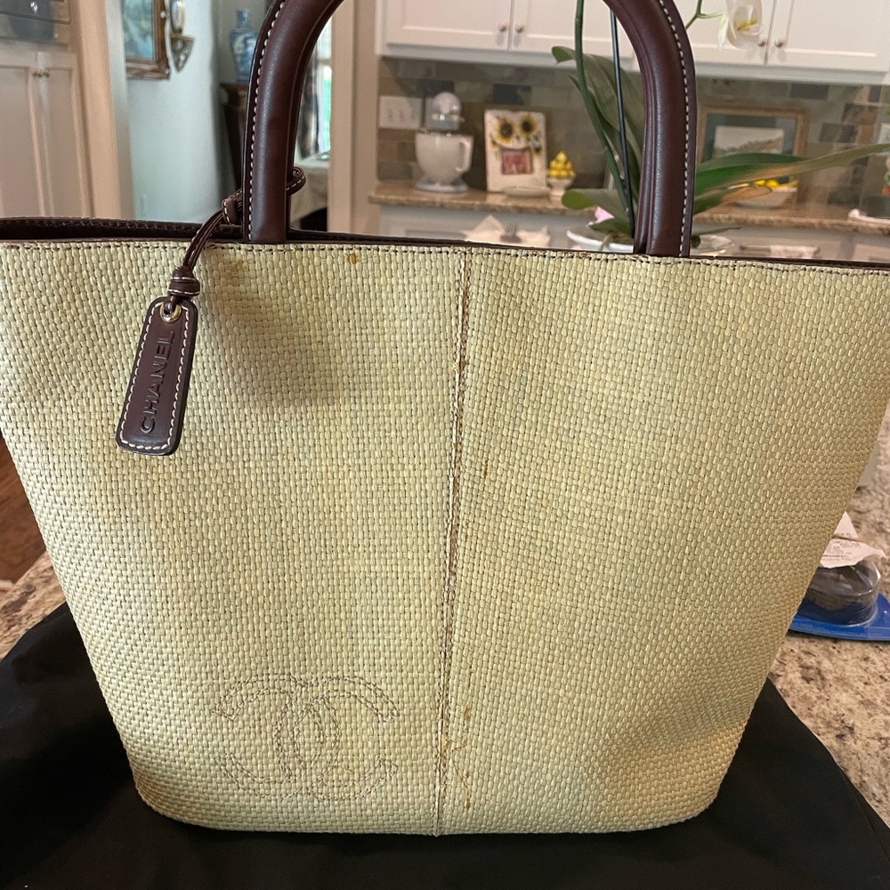 Chanel- beautiful Italian straw and leather tote in excellent shape.